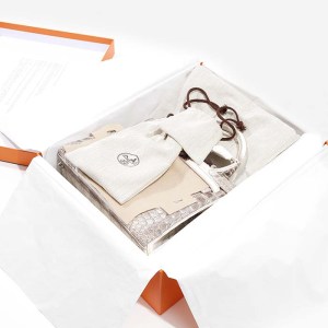 product image of inside hermes box featuring himalaya kelly FASHIONPHILE